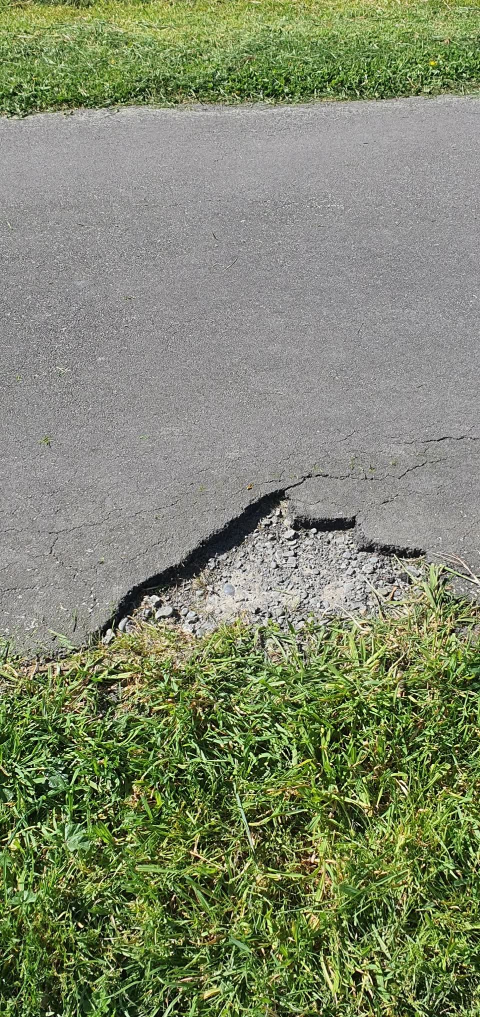 The photograph attached to this damaged road report