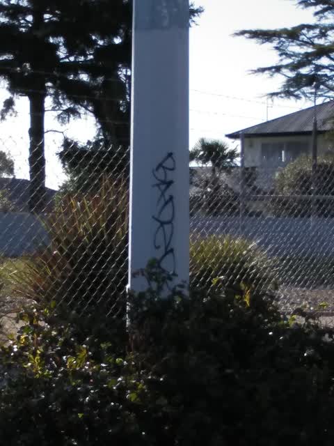 Graffiti - Concrete Street Light Pole, a report photo