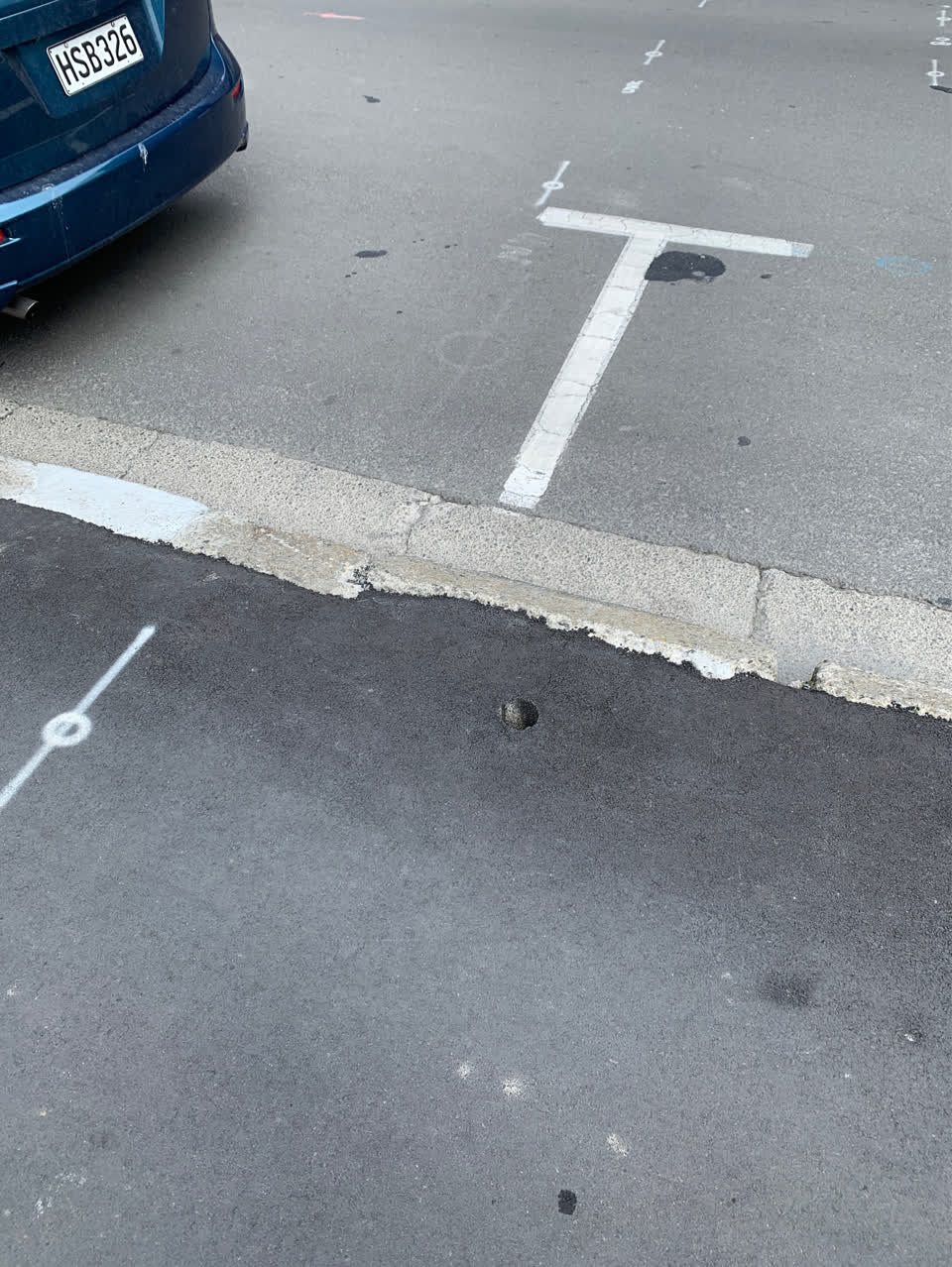 The photograph attached to this damaged street sign report