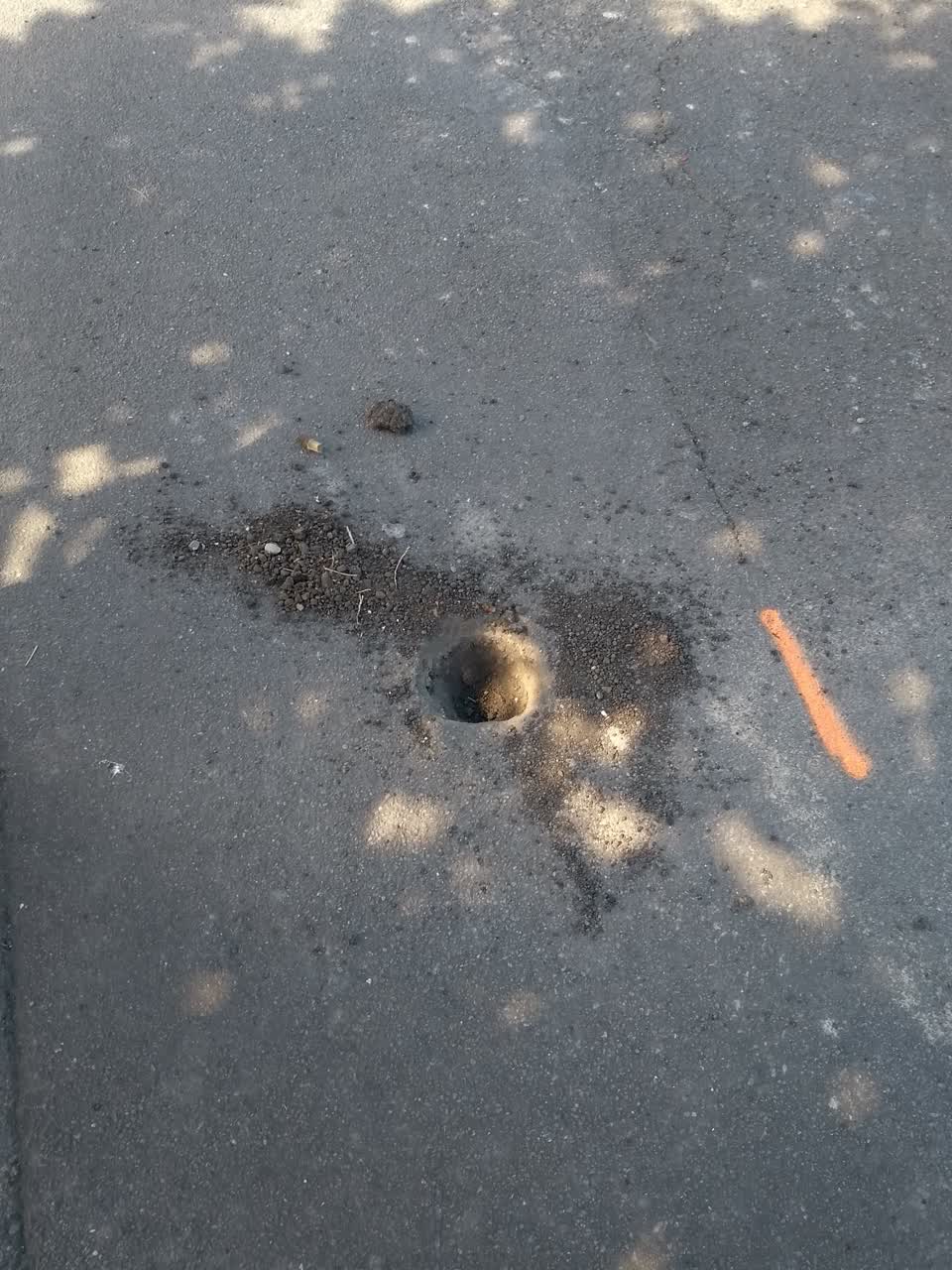 The photograph attached to this pavement - damaged report