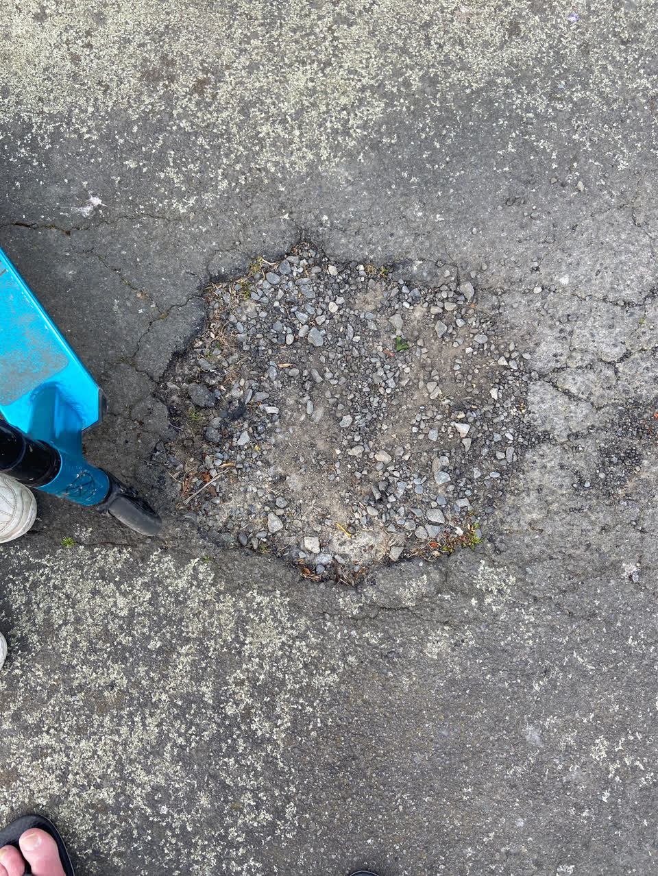 The photograph attached to this pavement - damaged report