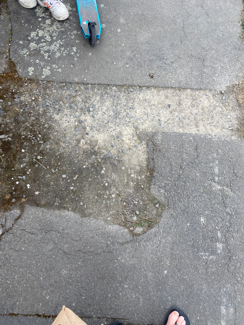 The photograph attached to this pavement - damaged report