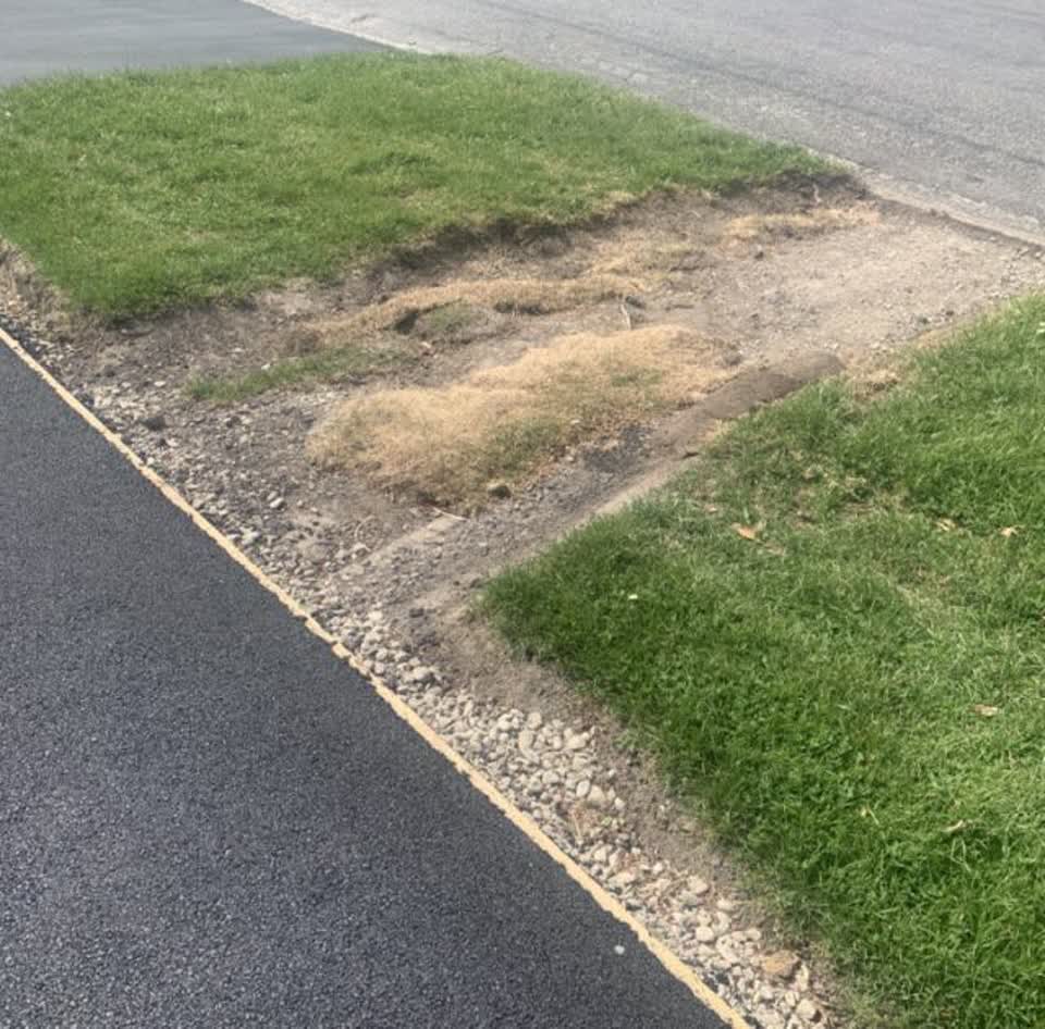 The photograph attached to this pavement - damaged report
