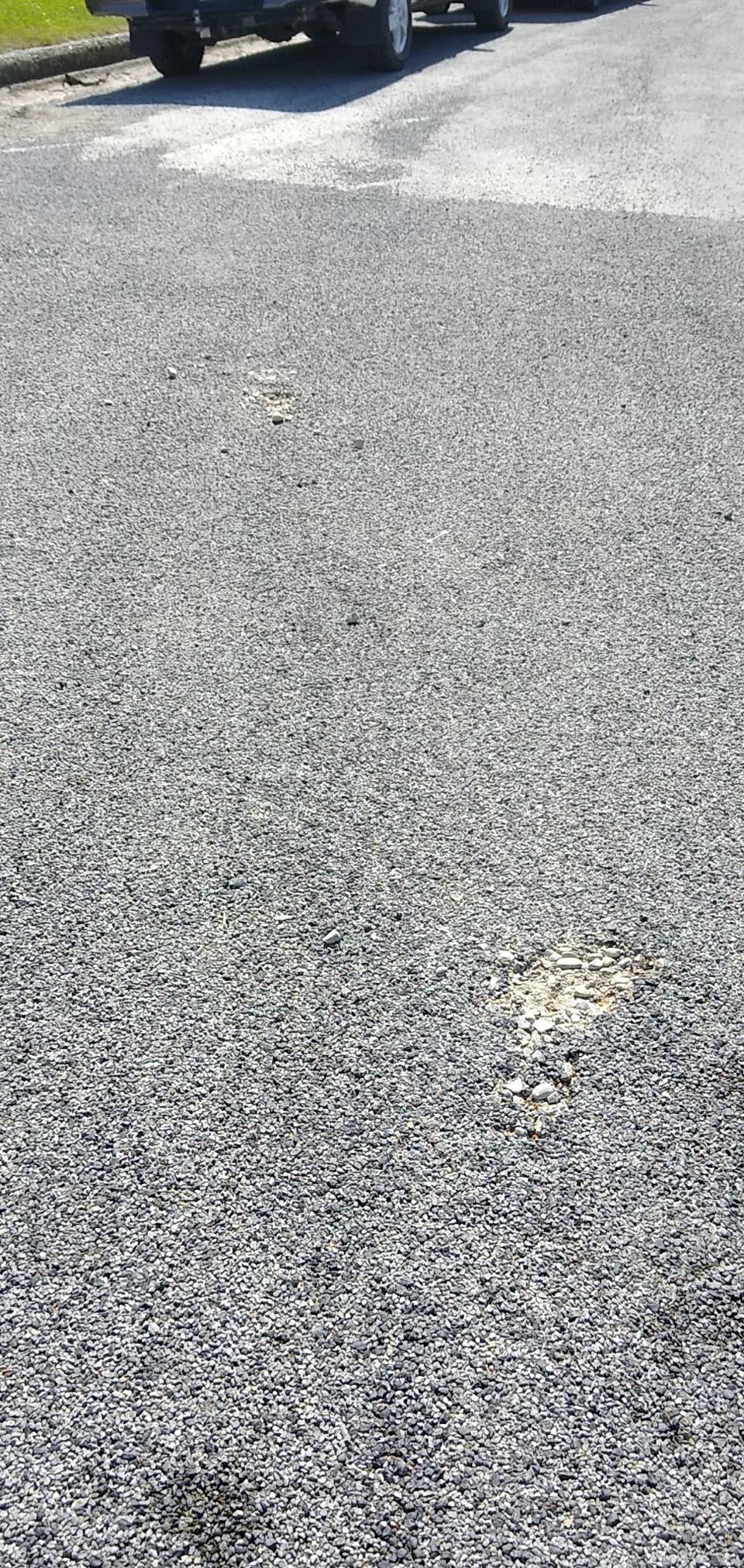 The photograph attached to this pavement - damaged report