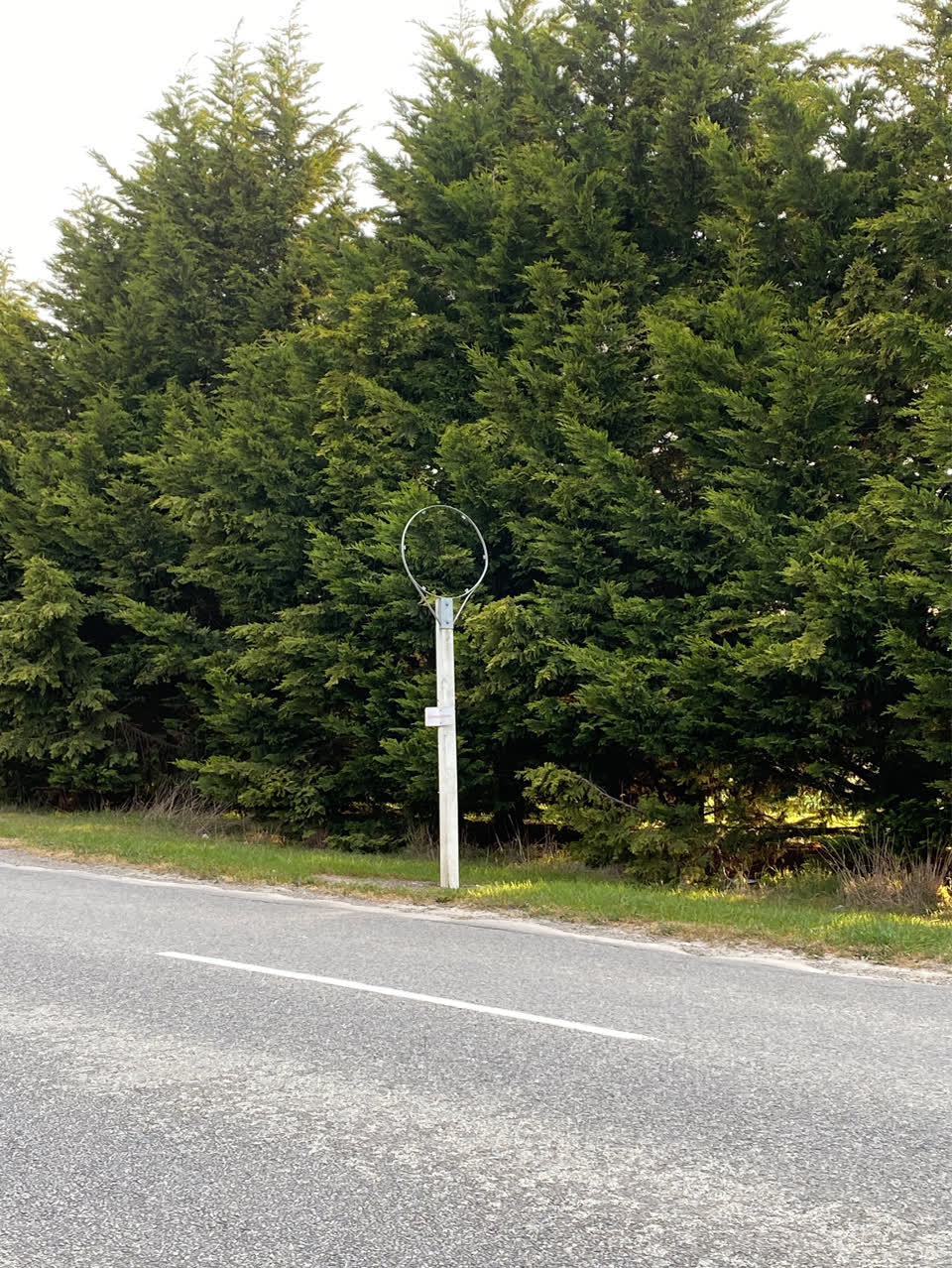The photograph attached to this damaged street sign report