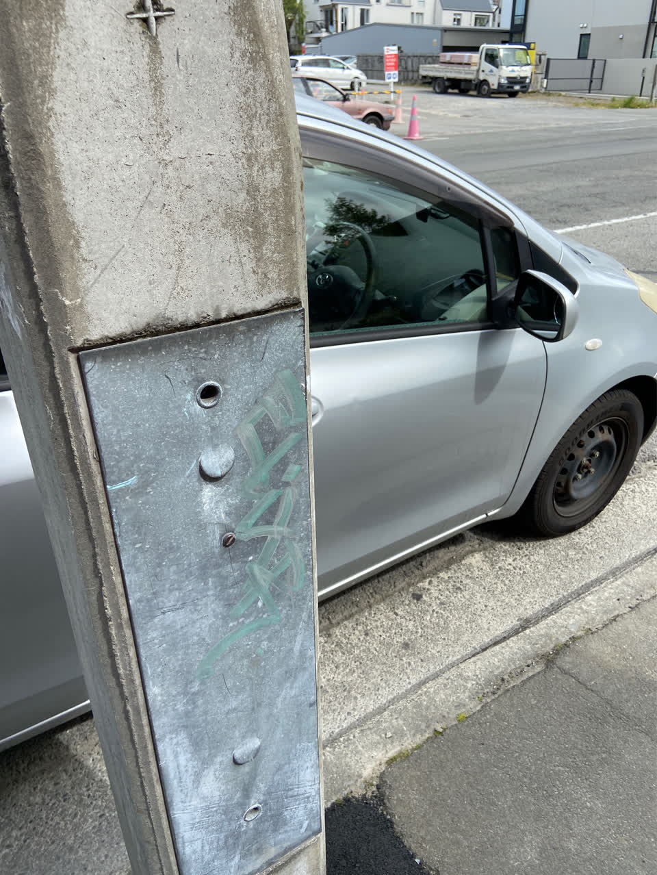The photograph attached to this graffiti - concrete street light pole report