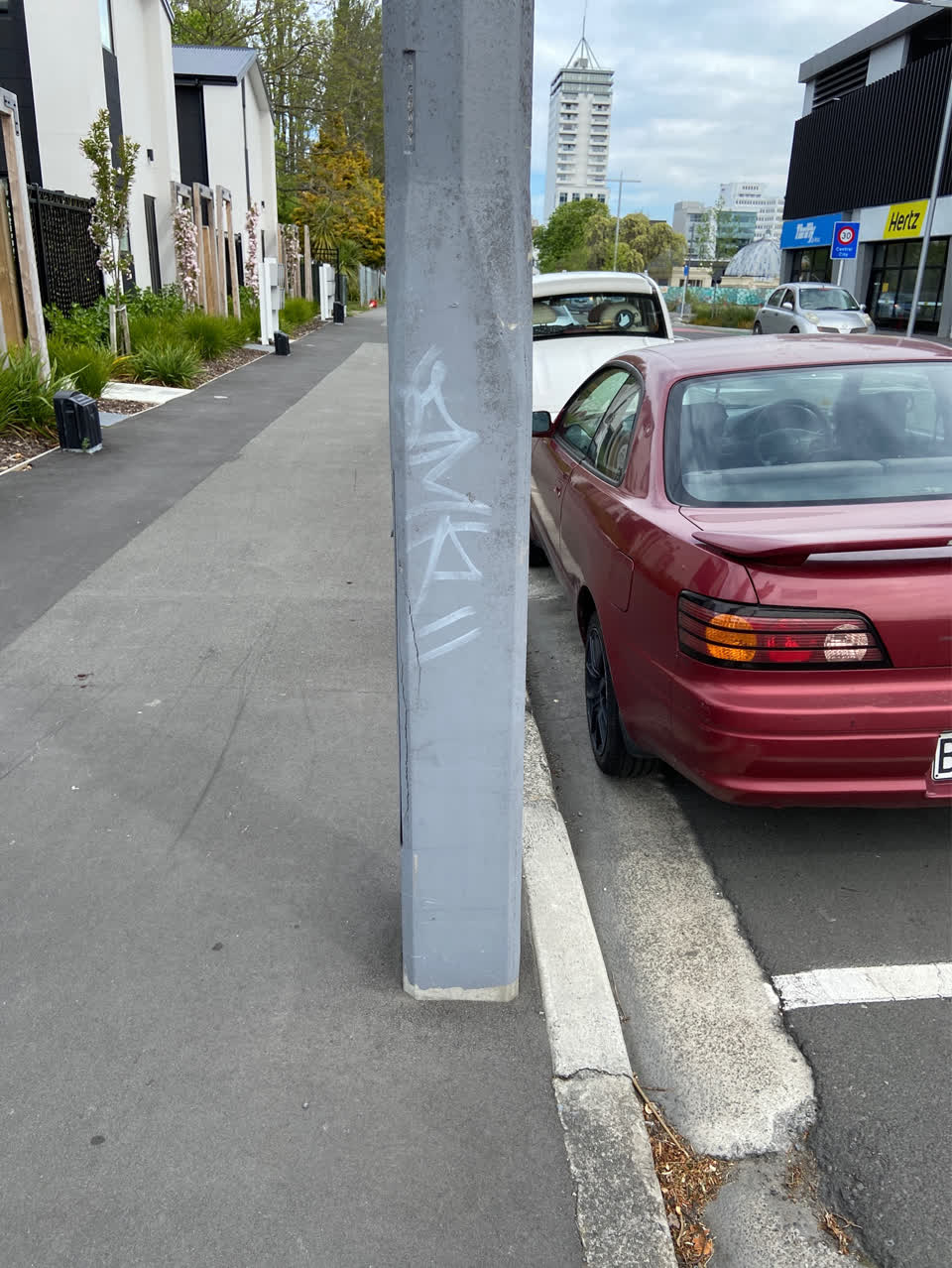 The photograph attached to this graffiti - concrete street light pole report