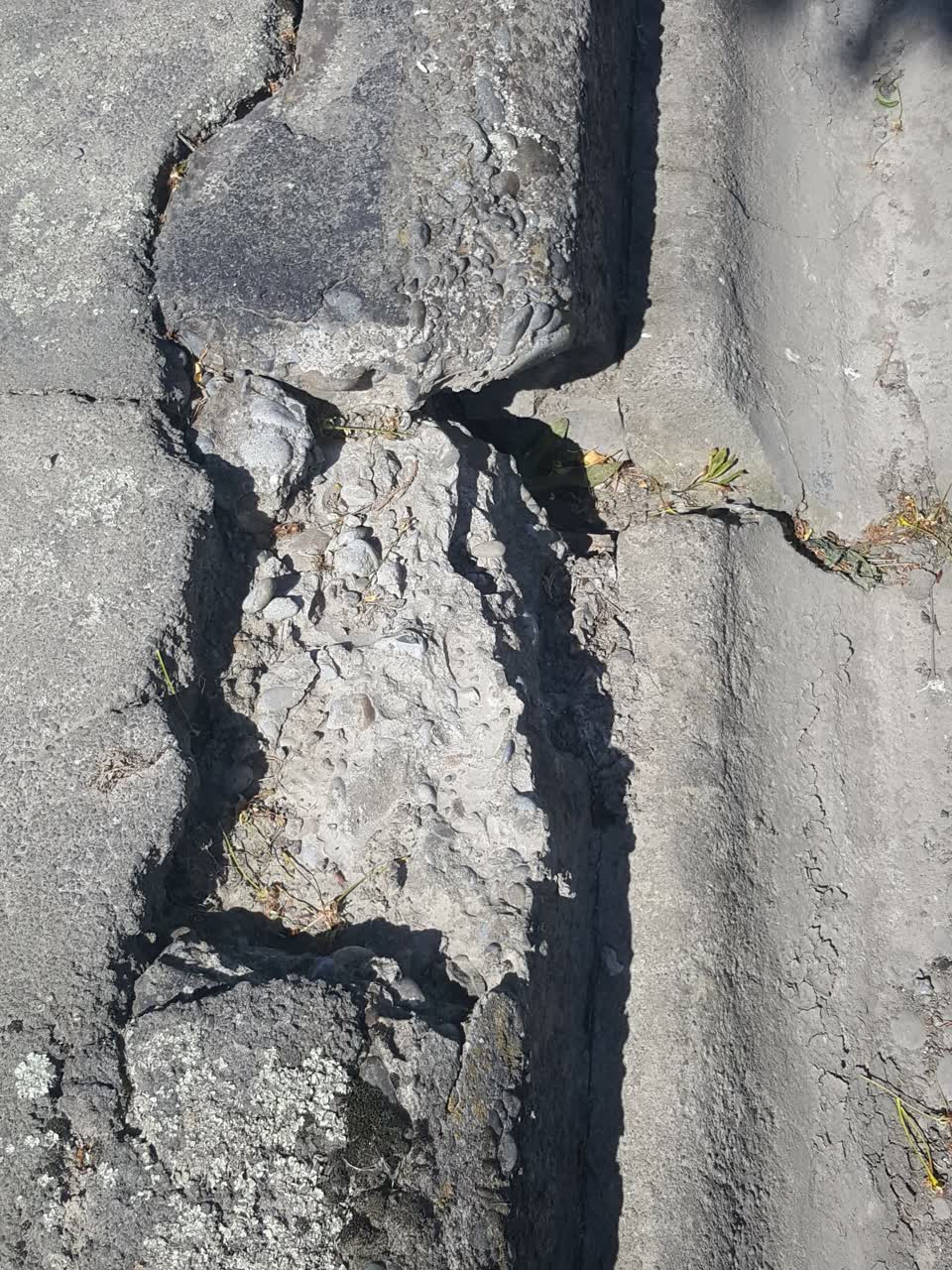 The photograph attached to this pavement - damaged report