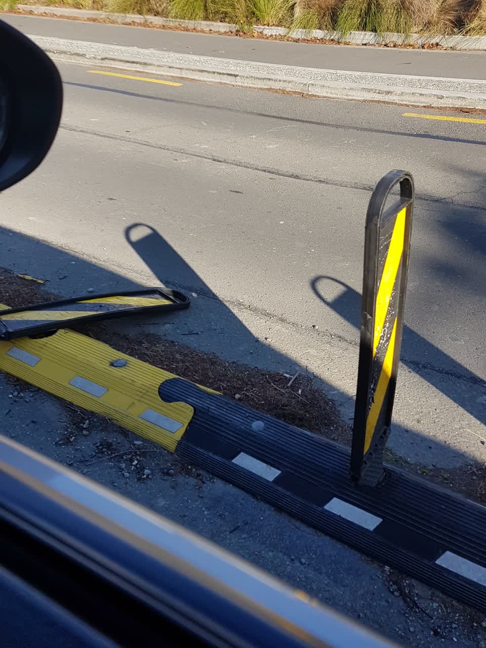 The photograph attached to this damaged street sign report