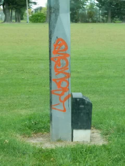 Graffiti - Concrete Street Light Pole, a report photo