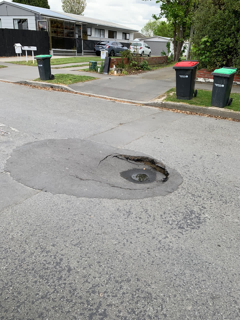 The photograph attached to this pavement - damaged report