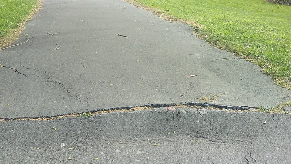 The photograph attached to this pavement - damaged report