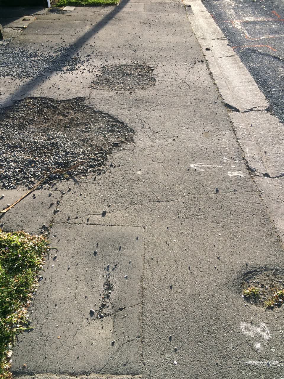 The photograph attached to this pavement - damaged report
