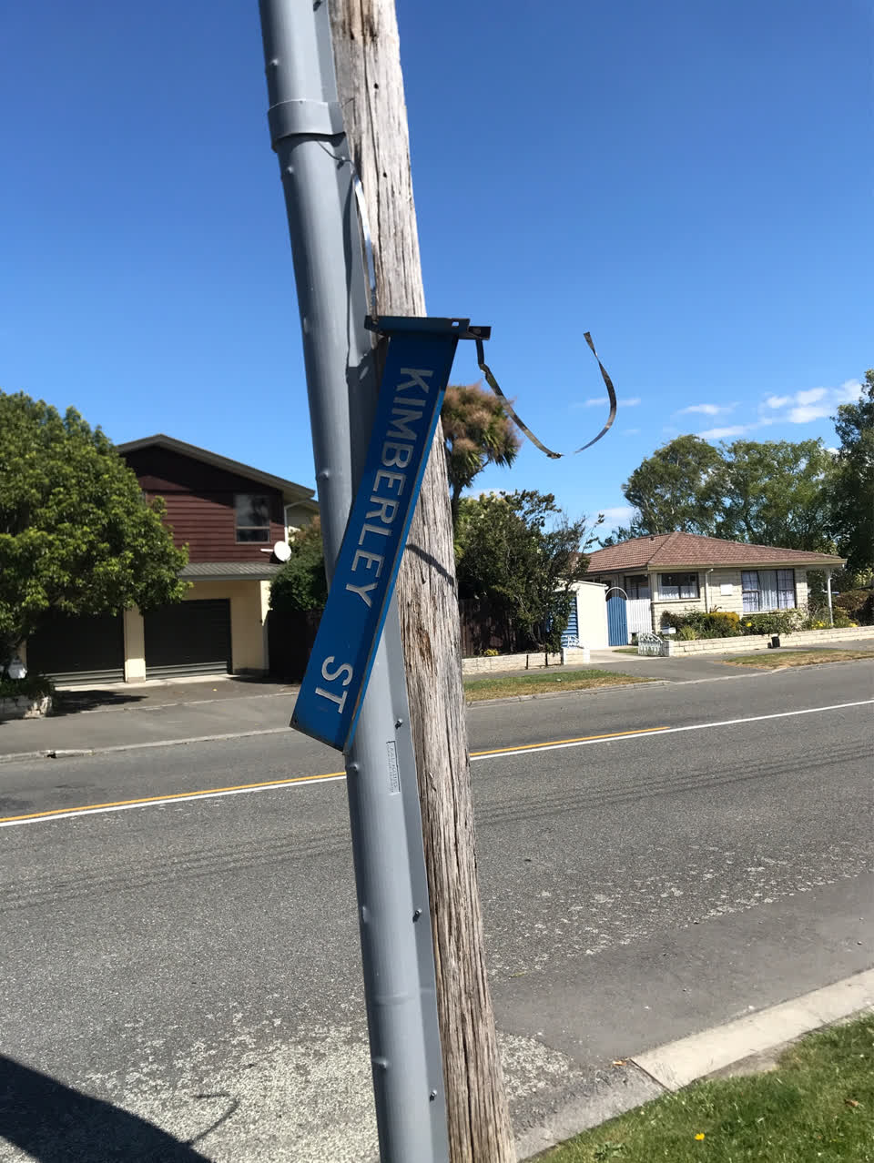The photograph attached to this damaged street sign report