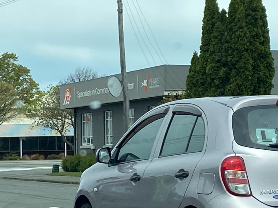 The photograph attached to this damaged street sign report