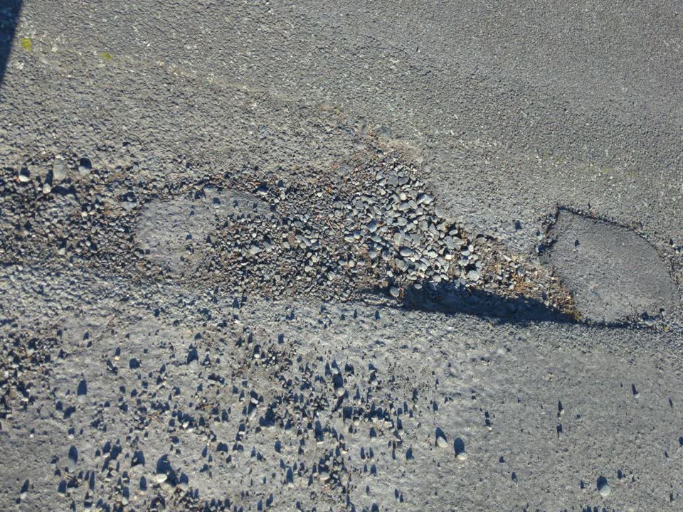 The photograph attached to this pothole report