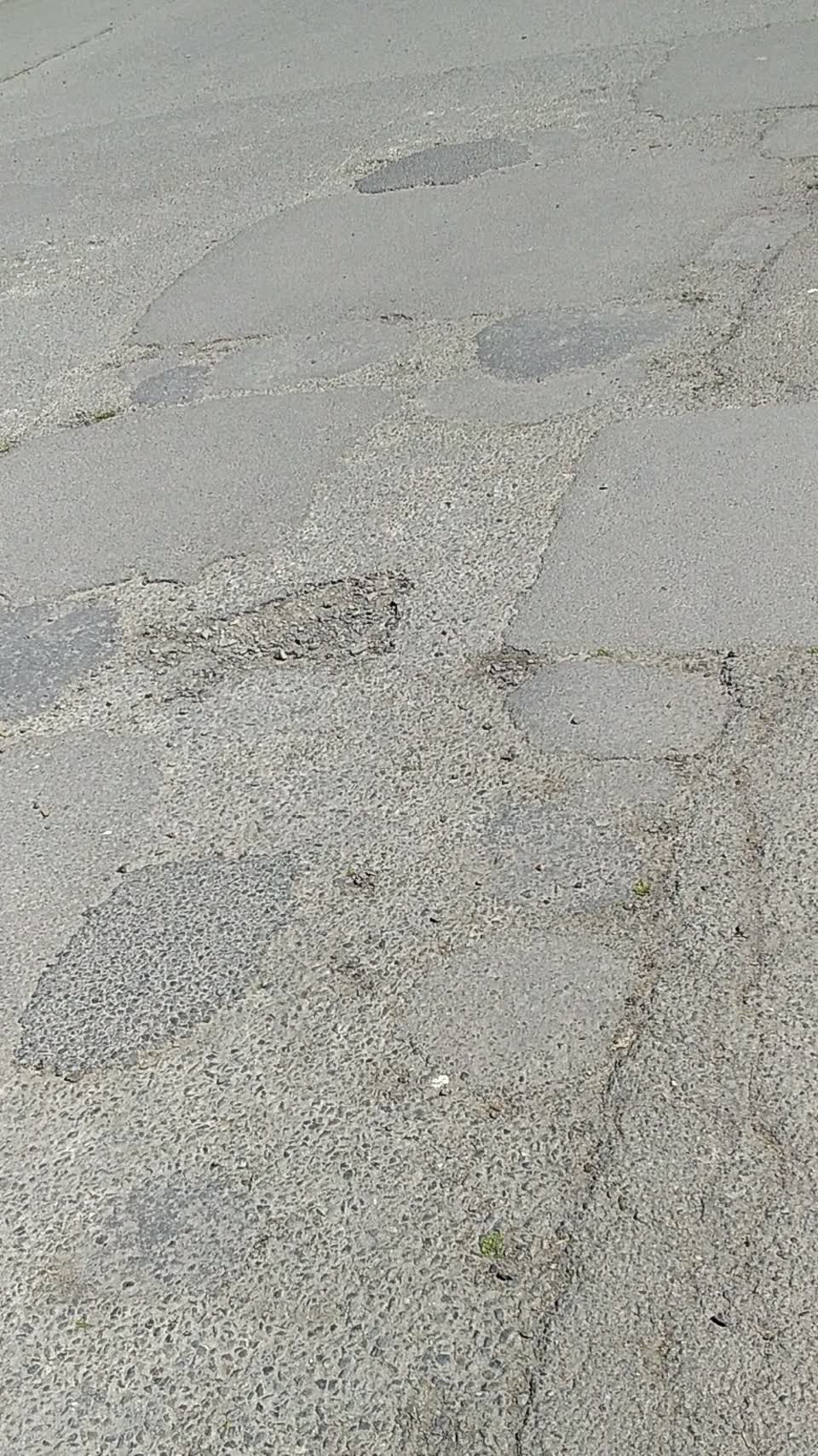 The photograph attached to this damaged road report