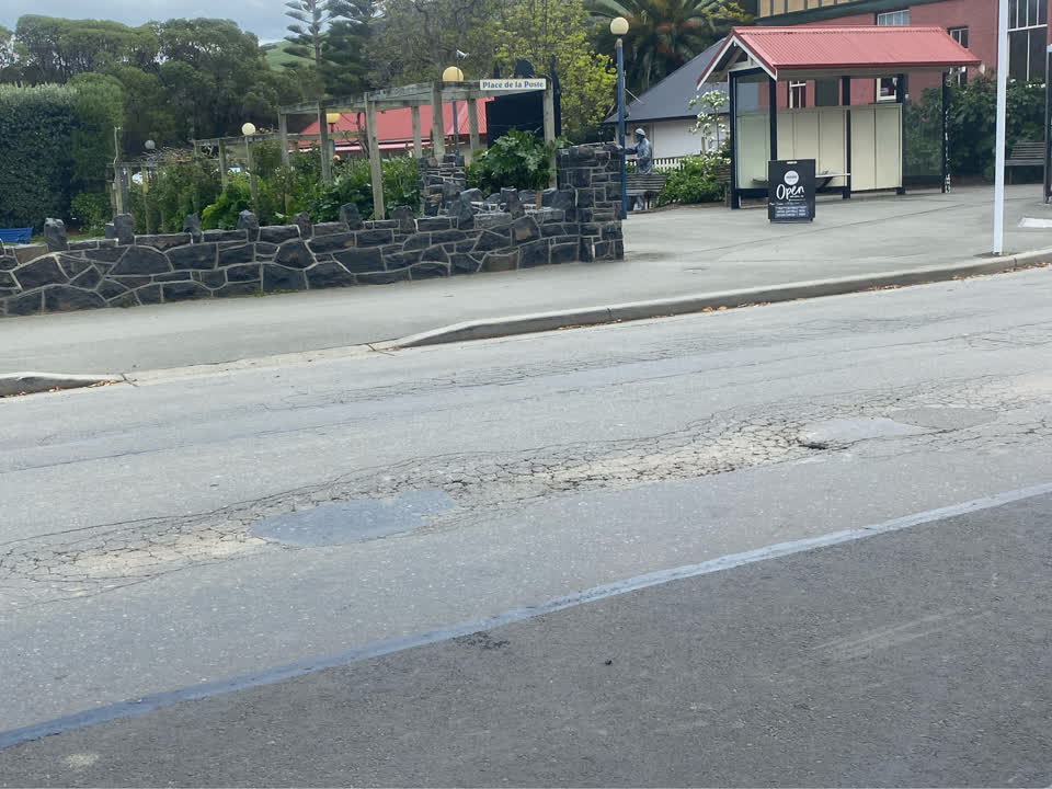 The photograph attached to this damaged road report