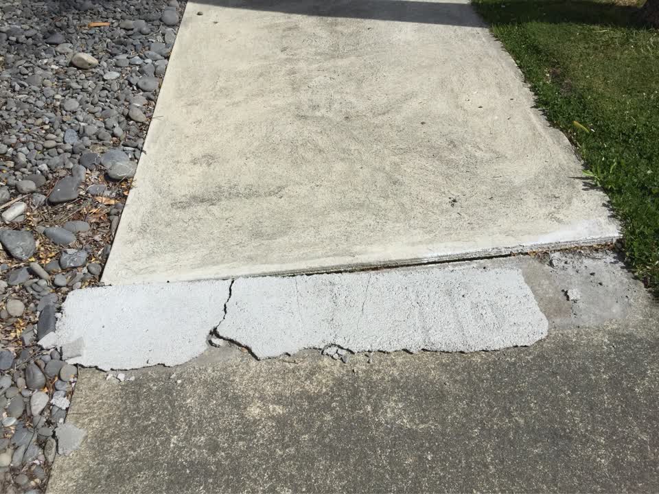The photograph attached to this pavement - damaged report