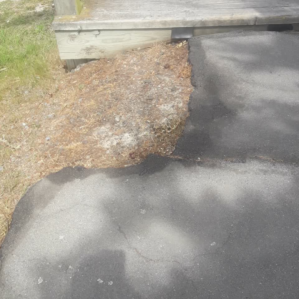 The photograph attached to this pavement - damaged report