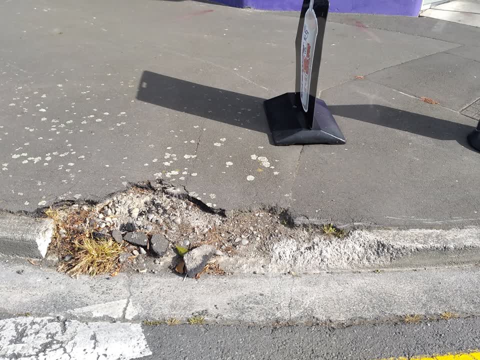 The photograph attached to this pavement - damaged report