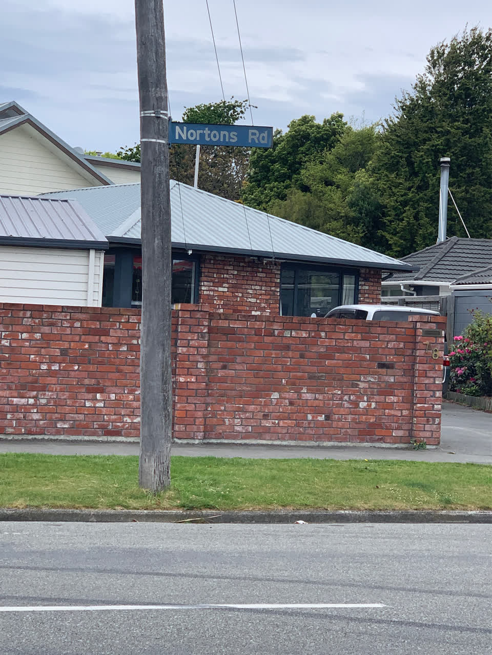 The photograph attached to this damaged street sign report