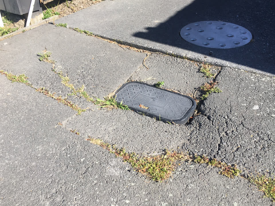 The photograph attached to this pavement - damaged report