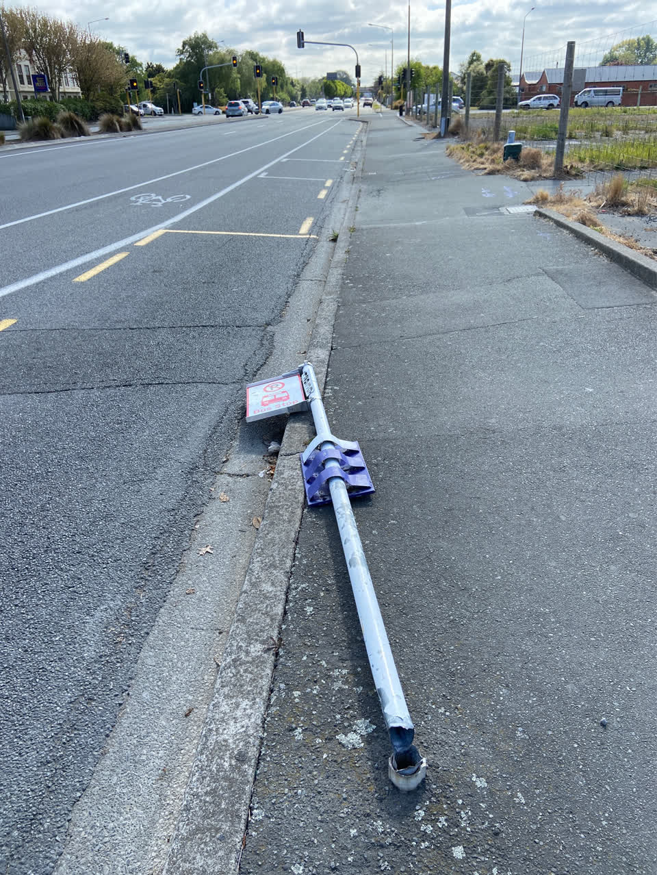 The photograph attached to this damaged street sign report