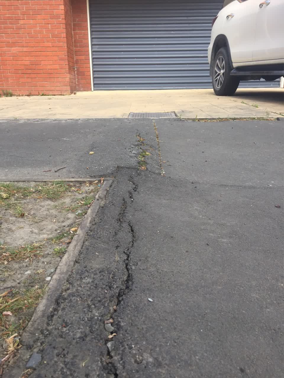 The photograph attached to this pavement - damaged report