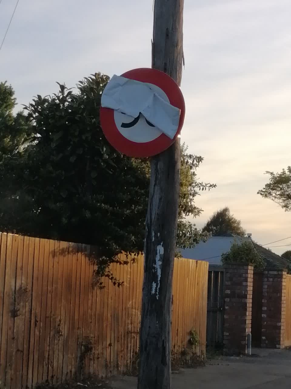 The photograph attached to this damaged street sign report