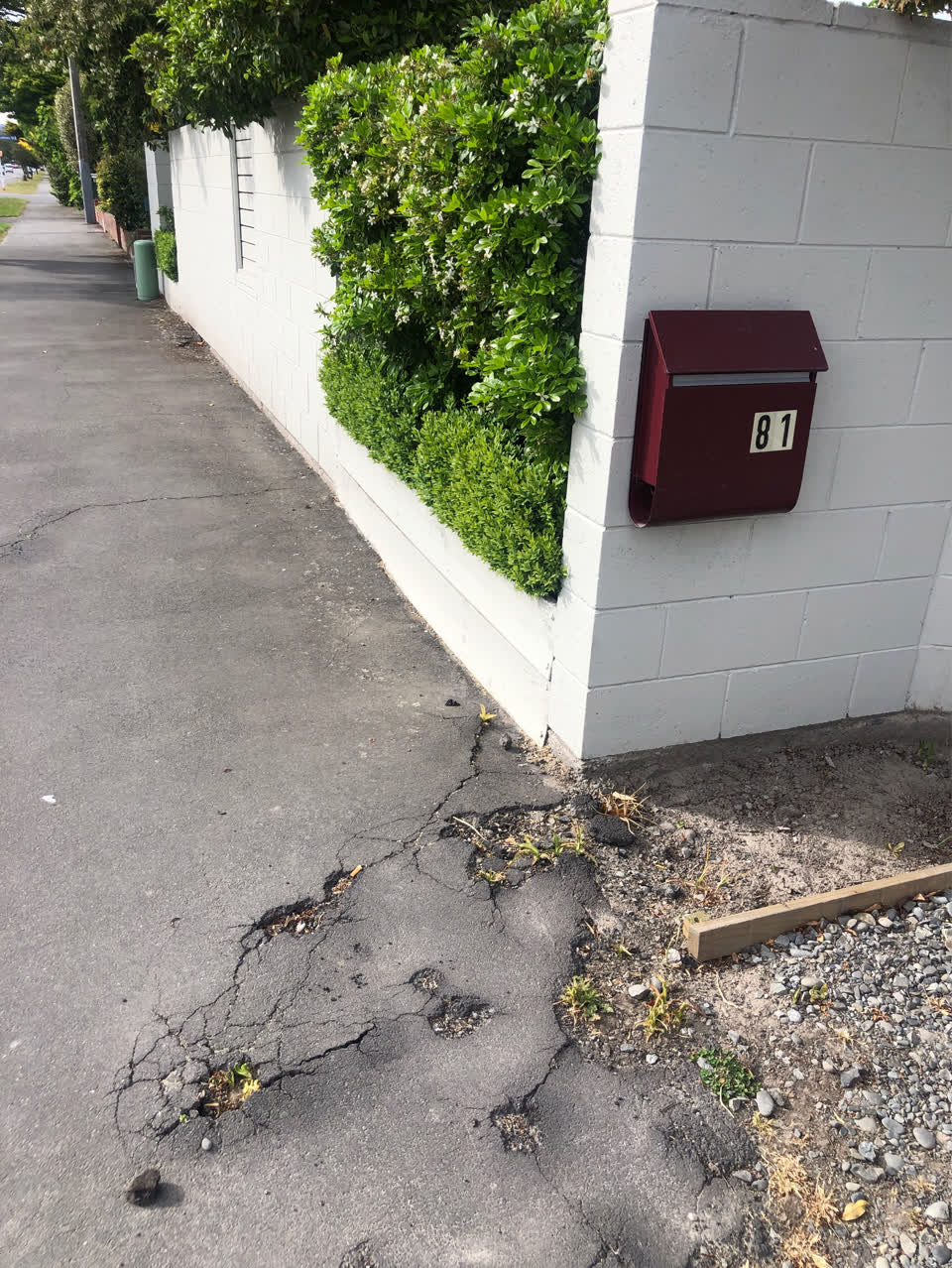 The photograph attached to this pavement - damaged report