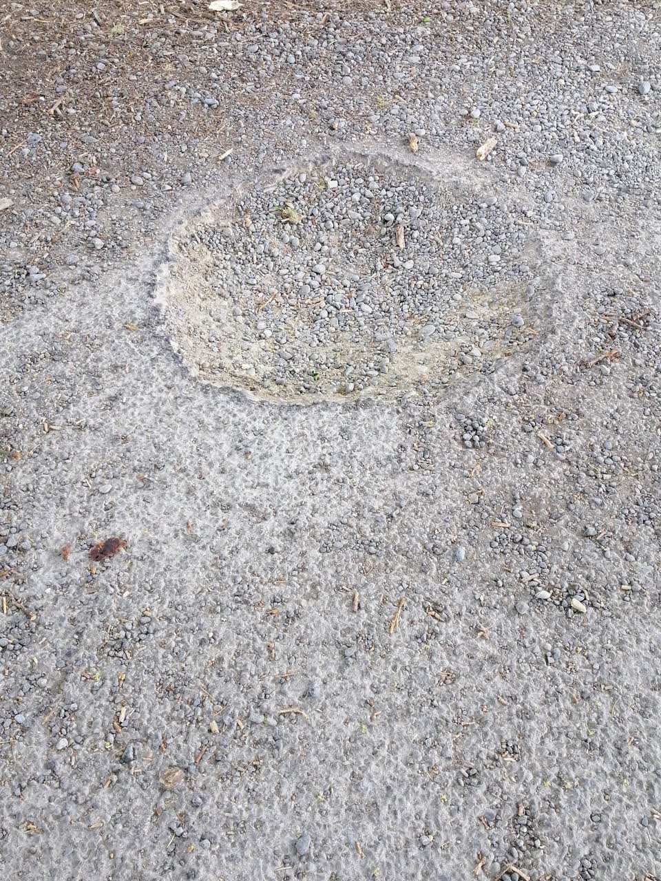 The photograph attached to this pothole report