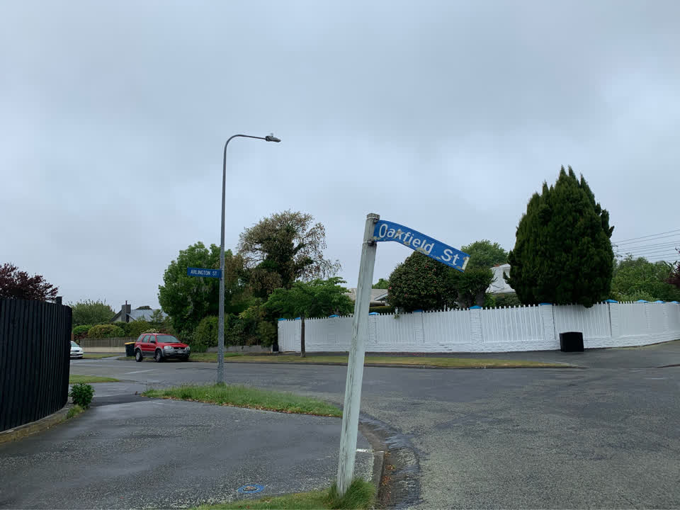 The photograph attached to this damaged street sign report