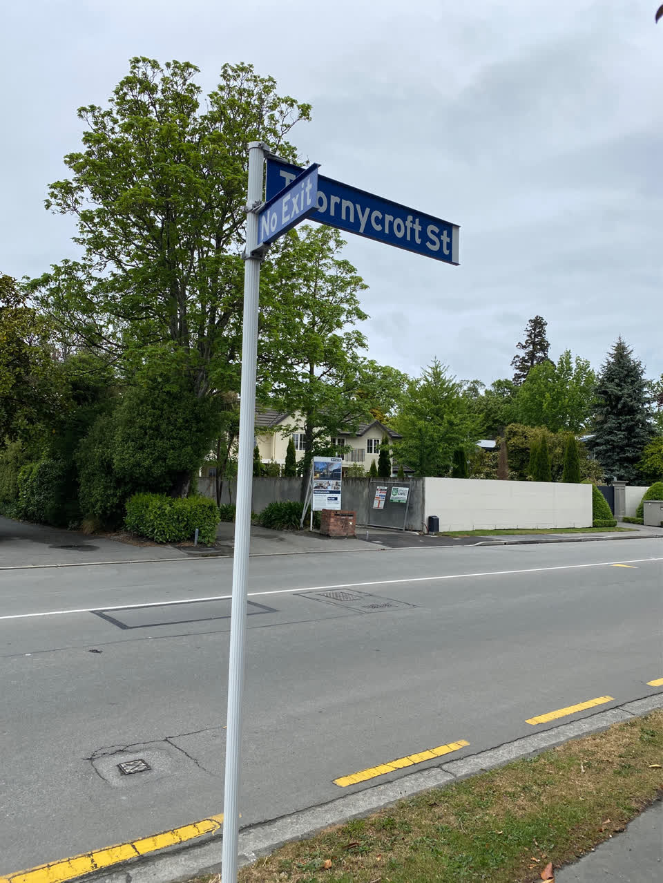 The photograph attached to this damaged street sign report