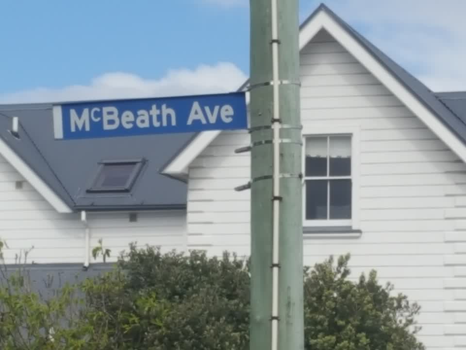 The photograph attached to this damaged street sign report