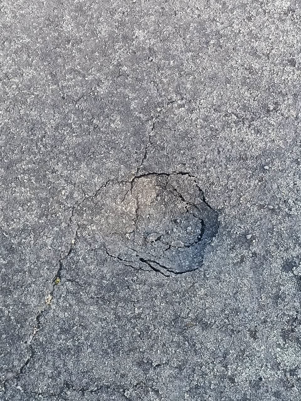 The photograph attached to this street light outage report