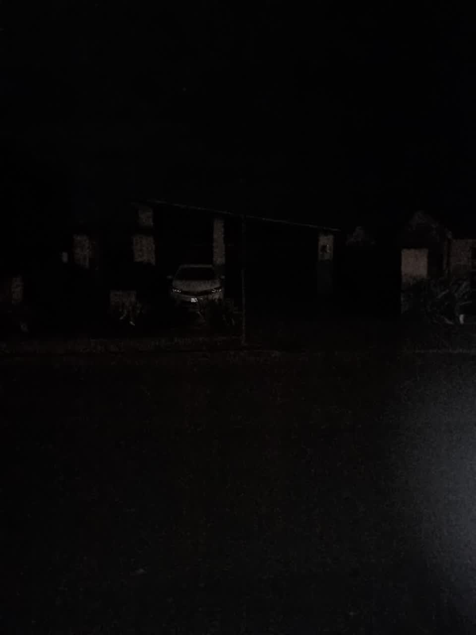 The photograph attached to this street light outage report