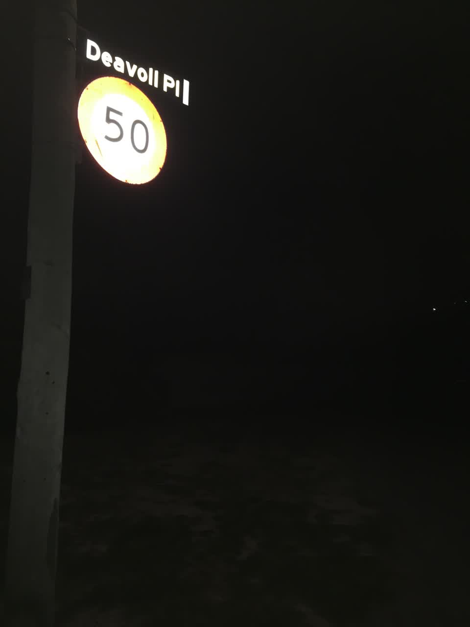 The photograph attached to this street light outage report