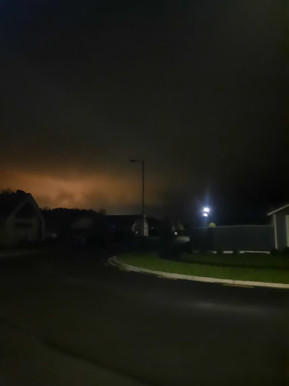The photograph attached to this street light outage report