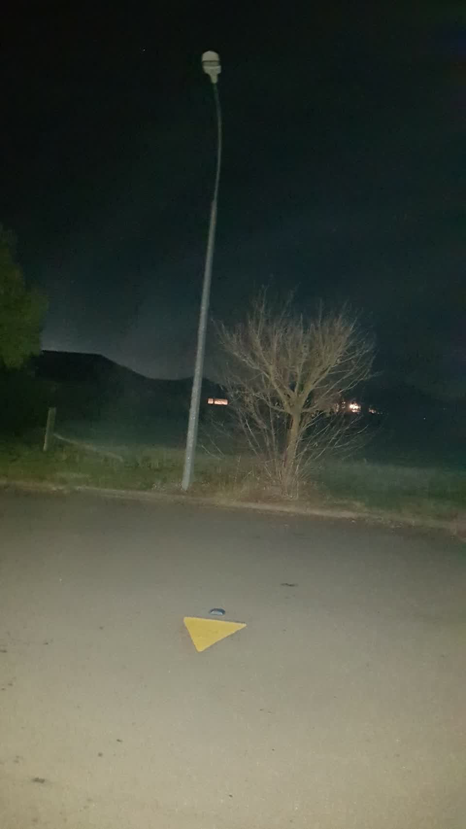 The photograph attached to this street light outage report