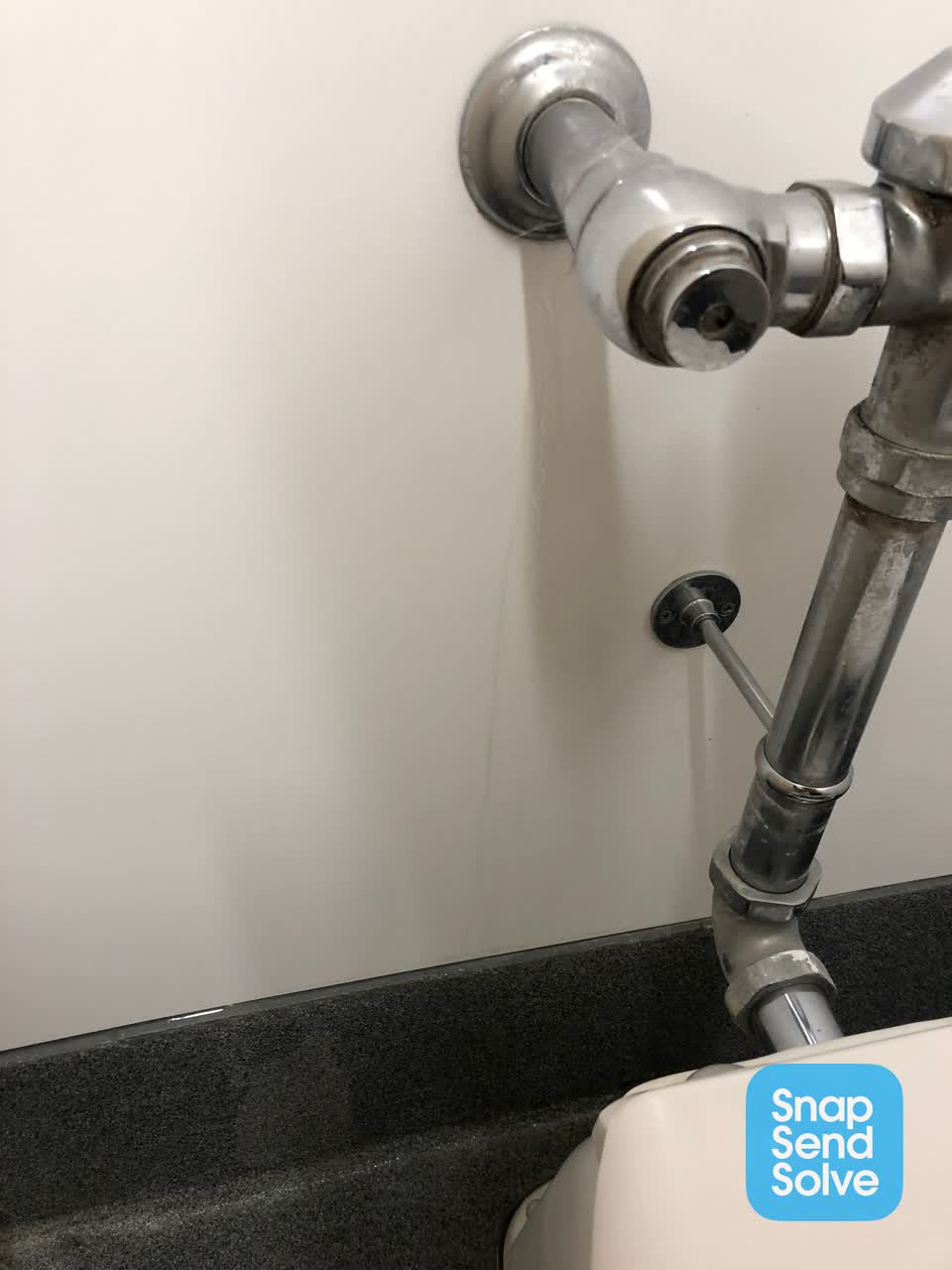 The photograph attached to this water leak report