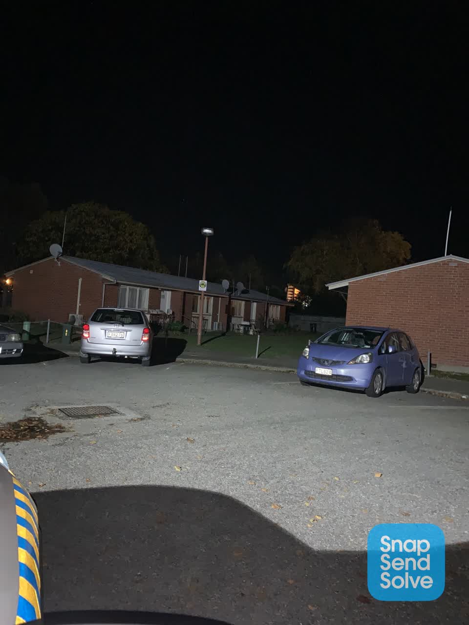 The photograph attached to this street light outage report