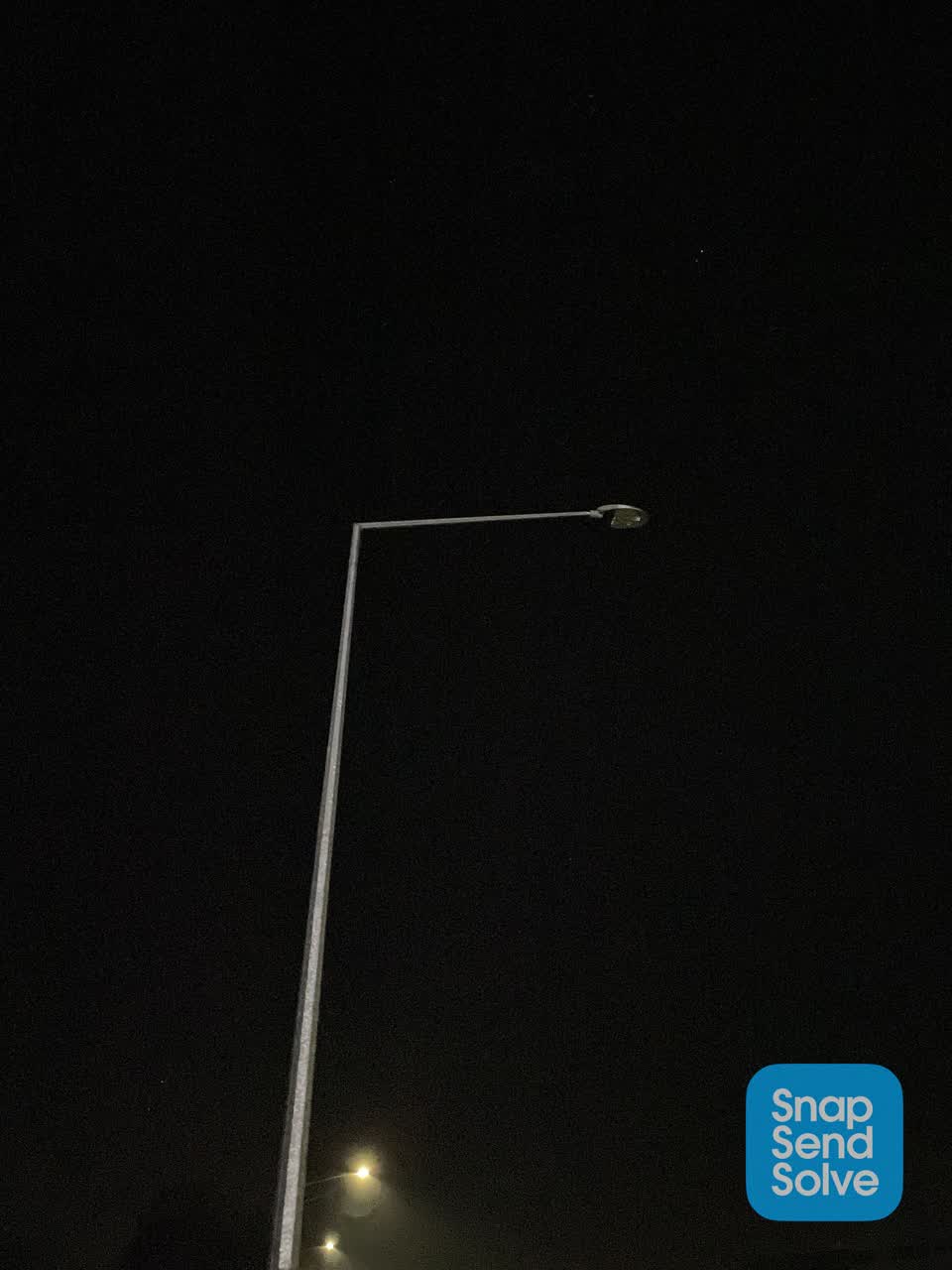 The photograph attached to this street light outage report