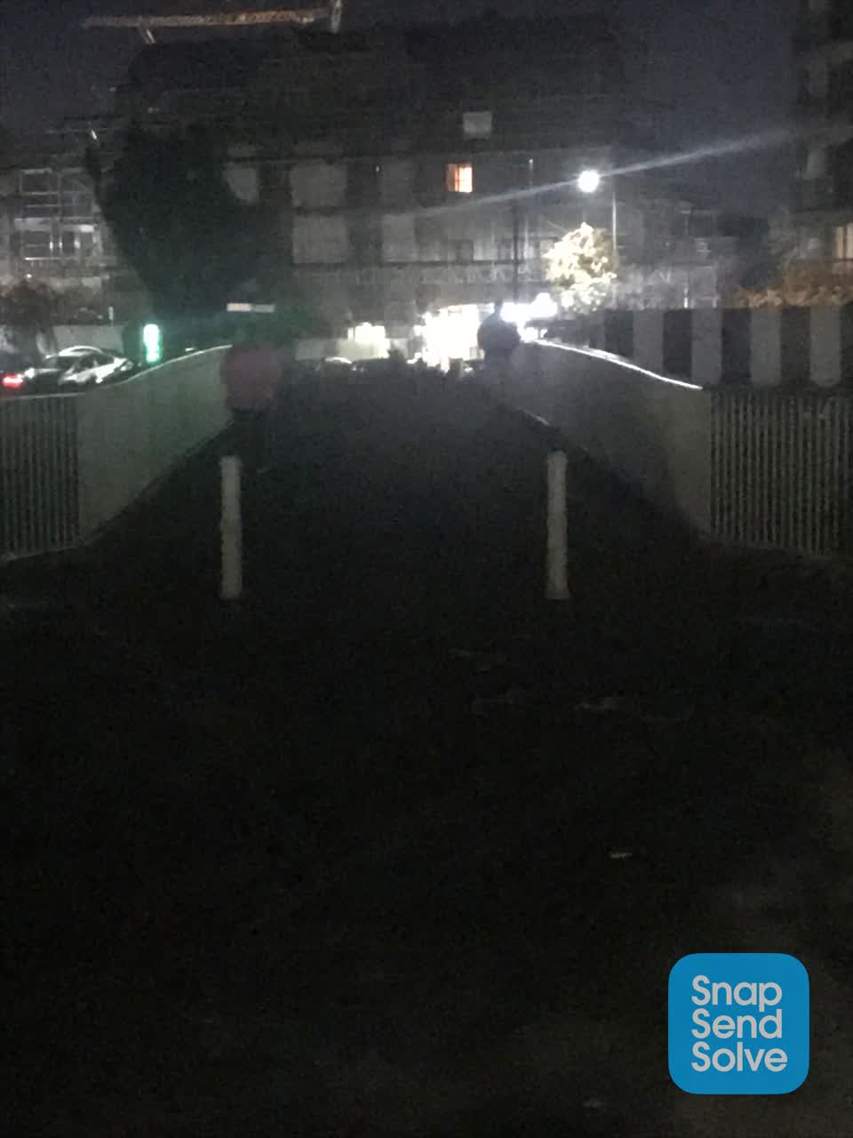The photograph attached to this street light outage report