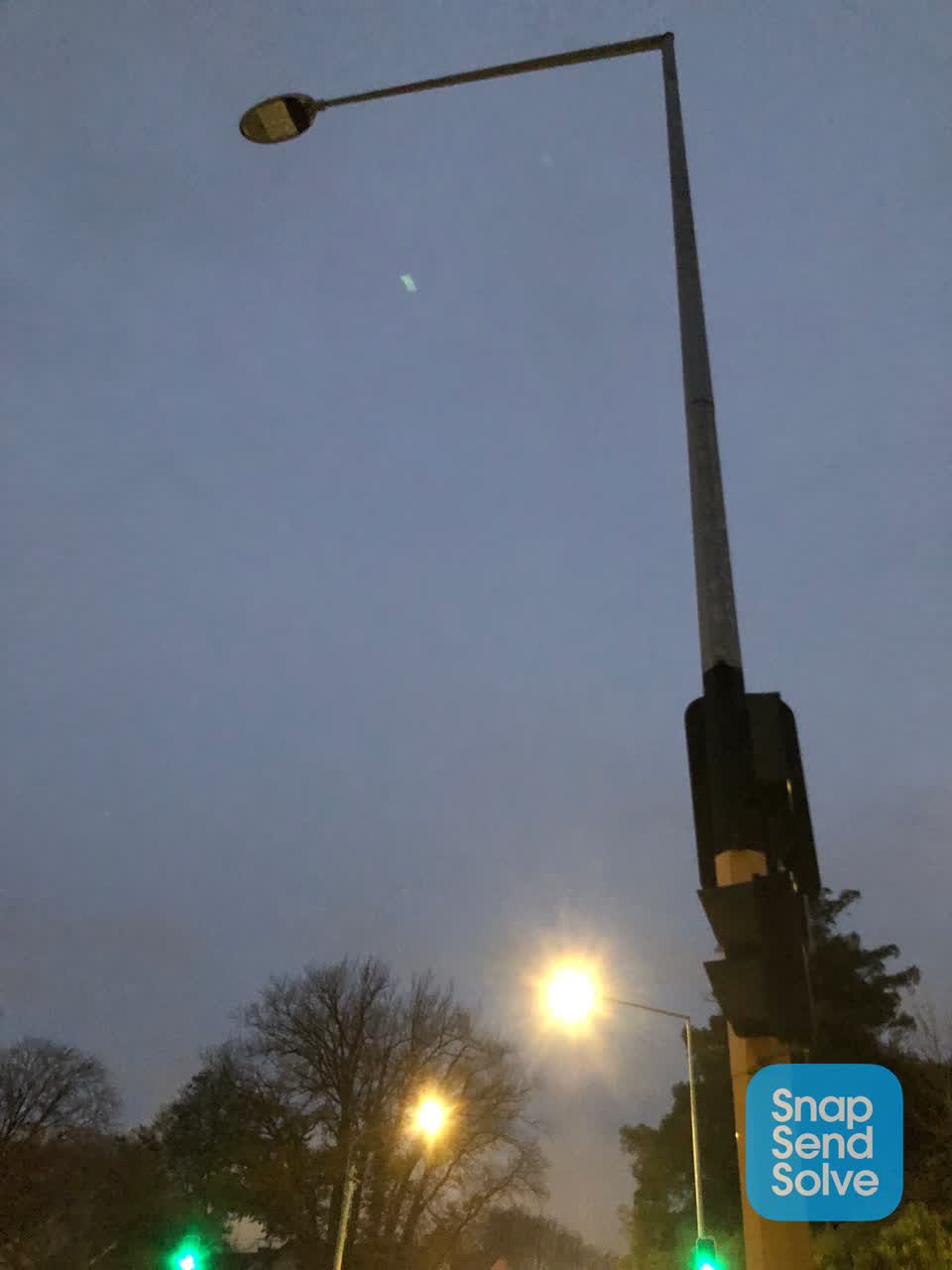 The photograph attached to this street light outage report