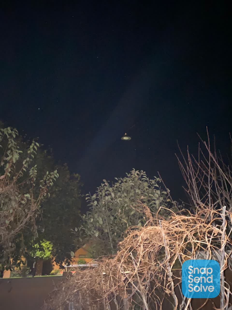 The photograph attached to this street light outage report