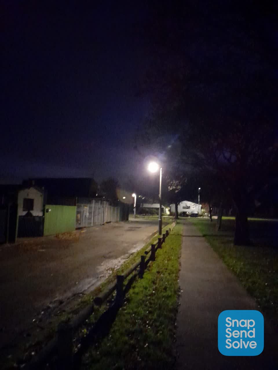 The photograph attached to this street light outage report