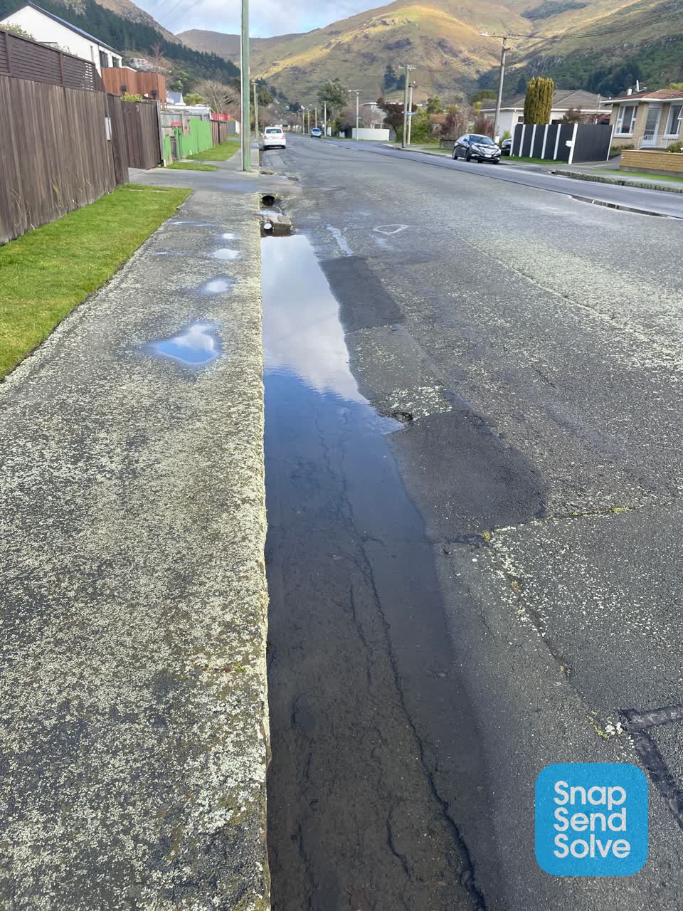 The photograph attached to this damaged road report