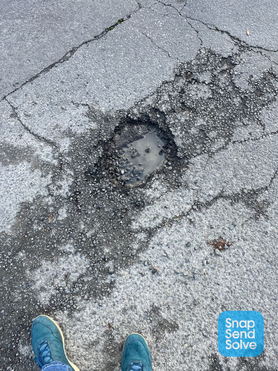 The photograph attached to this damaged road report