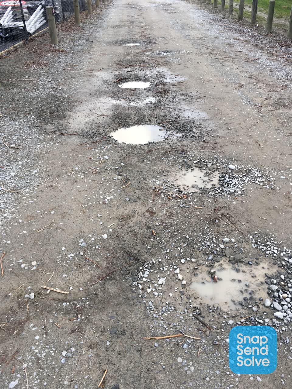 The photograph attached to this damaged road report